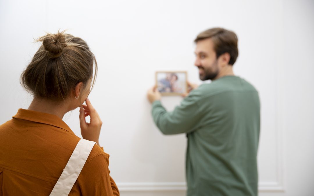 Young couple moving into their new home as a cohabiting couple as divorce is on the decrease and couples increasingly choosing to cohabit