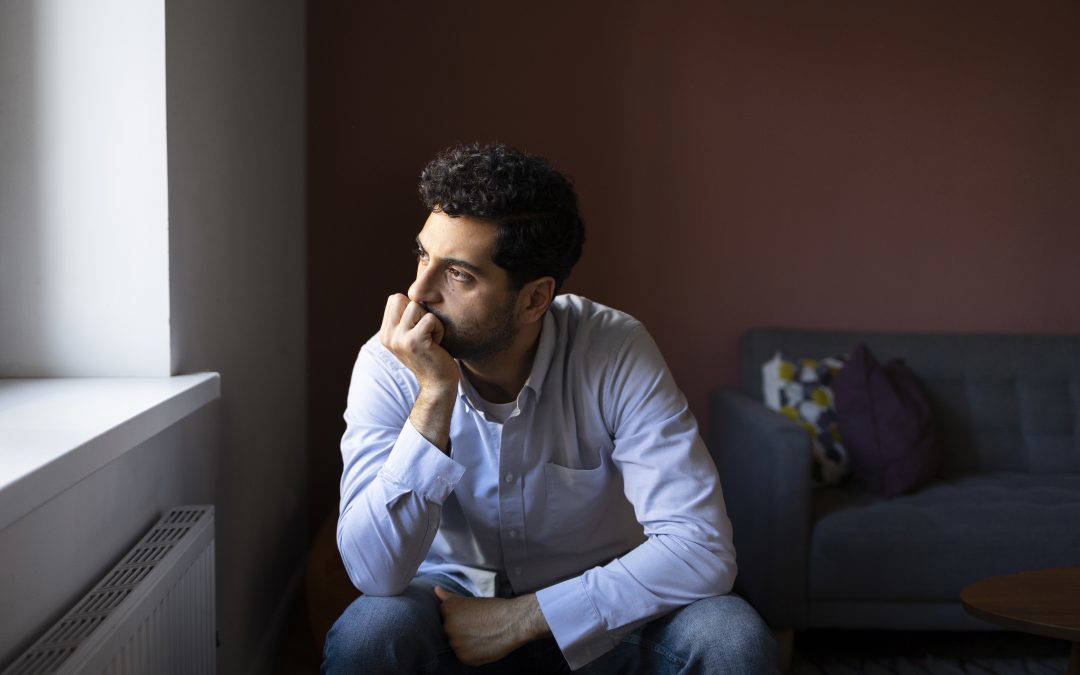 Man looks anxious considering time to separate with partner after the holidays